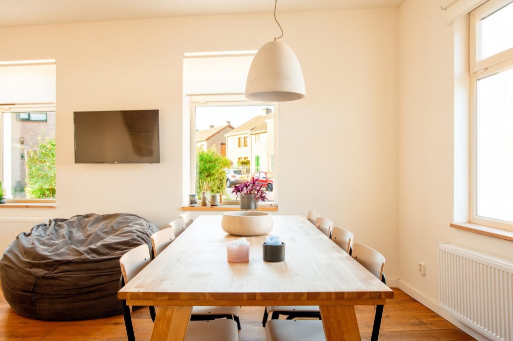 The beautiful large table in the living room in Limburg. Enough chairs for 8 people.